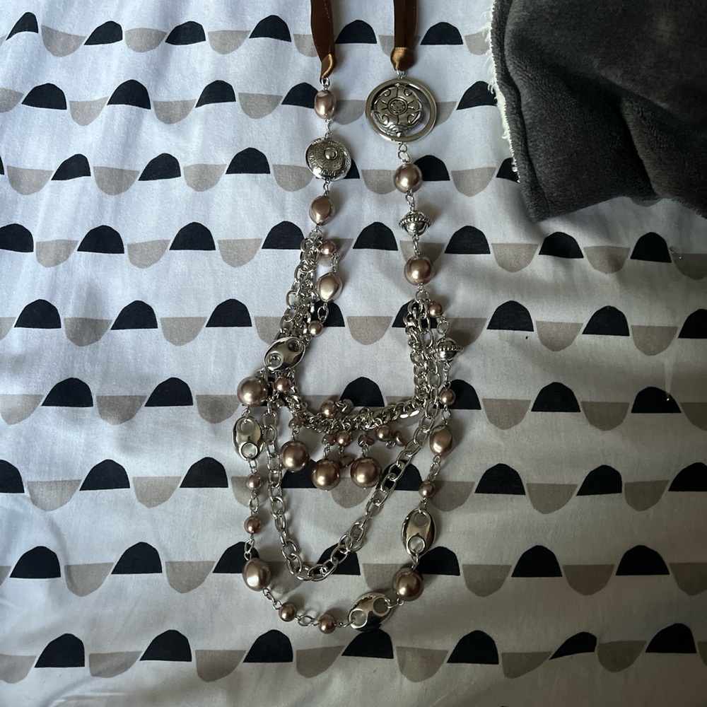 Silver layered necklace with a touch of boho charm